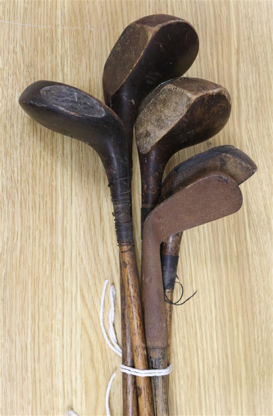 Five vintage golf clubs